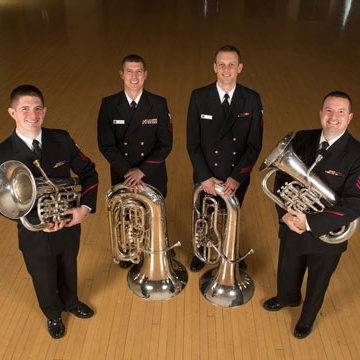 four Navy musicians with their tubas