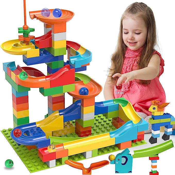 Child playing with Marble run toy set