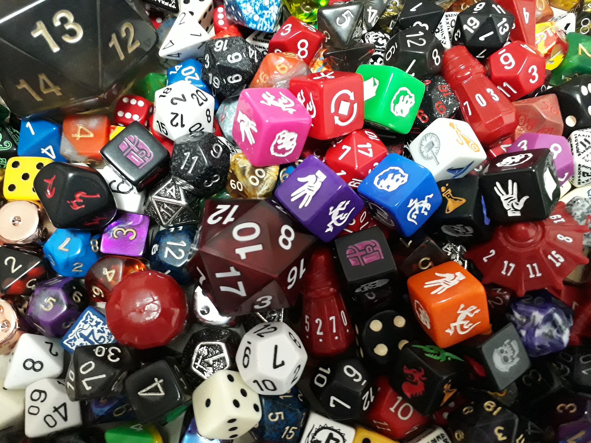 An image depicting a large pile of colorful dice. 
