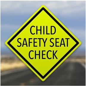 a caution sign that says child safety seat check
