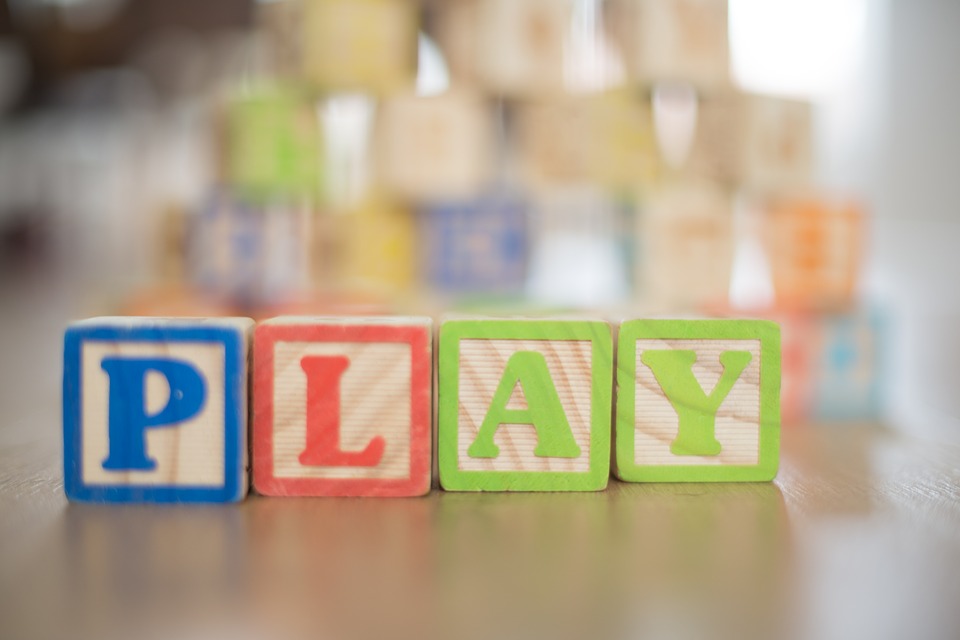 blocks that spell out the word play