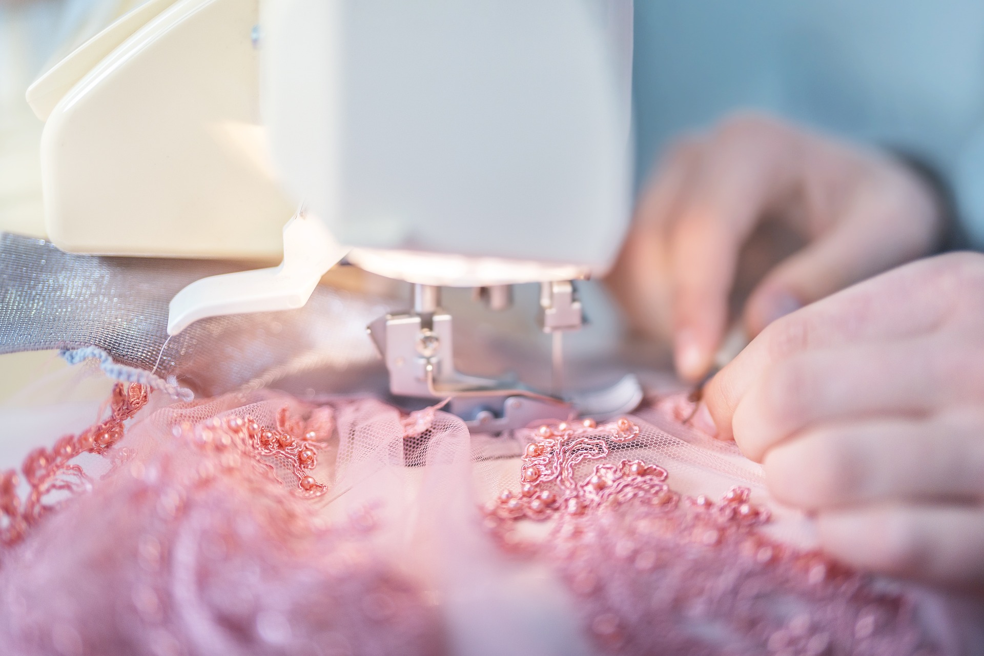 An image of someone using a sewing machine