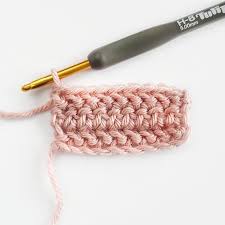 pink yarn and crochet hook