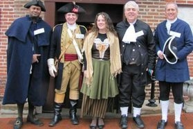 group dressed in colonial clothing