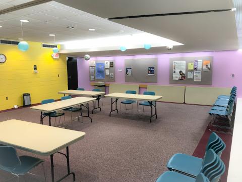 Brooklyn Park Community Meeting Room with rectangular tables and two chairs at each table