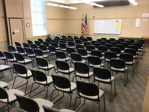 Crofton Community Meeting Room with chairs arranged in an auditorium-style with whiteboard at front