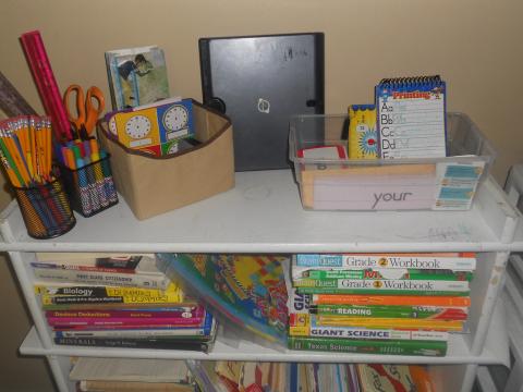 Homeschool Book Swap: A cart covered in books and school supplies