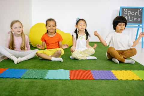 Image of children meditating in easy pose