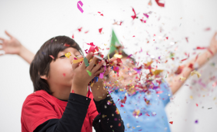 Children throwing confetti