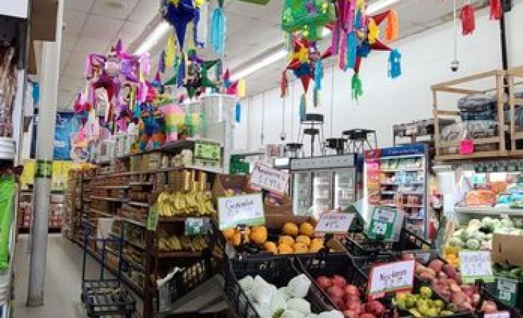 Supermarket with fruit and pinatas